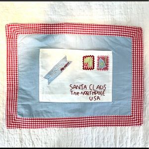 Pottery Barn Kids pillow with a pocket to put a letter to Santa in.